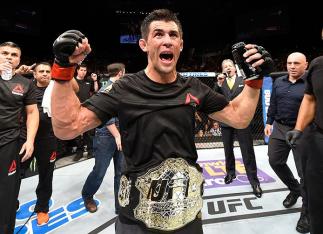 INGLEWOOD, CA - JUNE 04: Dominick Cruz celebrates after defeating Urijah Faber by unanimous decision in their UFC bantamweight championship bout during the UFC 199 event at The Forum on June 4, 2016 in Inglewood, California. (Photo by Josh Hedges/Zuffa