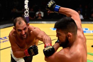 LAS VEGAS, NV - JULY 09: (L-R) Johny Hendricks punches Kelvin Gastelum in their welterweight bout during the UFC 200 event on July 9, 2016 at T-Mobile Arena in Las Vegas, Nevada. (Photo by Josh Hedges/Zuffa LLC/Zuffa LLC via Getty Images) *** Local Capti