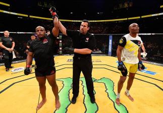 LAS VEGAS, NV - JULY 09: Daniel Cormier (left) reacts to his victory over Anderson Silva of Brazil (right) in their light heavyweight bout during the UFC 200 event on July 9, 2016 at T-Mobile Arena in Las Vegas, Nevada. (Photo by Josh Hedges/Zuffa LLC/Zu