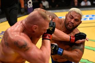 LAS VEGAS, NV - JULY 09: (R-L) Mark Hunt of New Zealand punches Brock Lesnar in their heavyweight bout during the UFC 200 event on July 9, 2016 at T-Mobile Arena in Las Vegas, Nevada. (Photo by Josh Hedges/Zuffa LLC/Zuffa LLC via Getty Images) *** Local