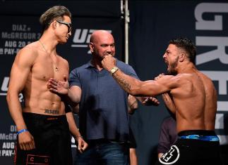 LAS VEGAS, NV - AUGUST 19:   (L-R) Opponents Hyun Gyu Lim of South Korea and Mike Perry face off during the UFC 202 weigh-in at the MGM Grand Hotel & Casino on August 19, 2016 in Las Vegas, Nevada. (Photo by Josh Hedges/Zuffa LLC/Zuffa LLC via Getty Image