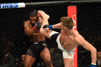 LAS VEGAS, NV - MARCH 04: (R-L) Stephen Thompson kicks Tyron Woodley in their UFC welterweight championship bout during the UFC 209 event at T-Mobile Arena on March 4, 2017 in Las Vegas, Nevada. (Photo by Josh Hedges/Zuffa LLC/Zuffa LLC via Getty Images)
