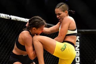 LAS VEGAS, NV - JULY 09: (R-L) Amanda Nunes of Brazil knees Miesha Tate in their UFC women's bantamweight championship bout during the UFC 200 event on July 9, 2016 at T-Mobile Arena in Las Vegas, Nevada. (Photo by Harry How/Zuffa LLC/Zuffa LLC via Getty