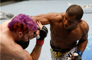 BRISBANE, AUSTRALIA - DECEMBER 07:  (R-L) Alex Garcia punches Ben Wall in their welterweight fight during the UFC Fight Night event at the Brisbane Entertainment Centre on December 7, 2013 in Brisbane, Australia. (Photo by Josh Hedges/Zuffa LLC/Zuffa LLC 