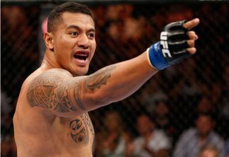BRISBANE, AUSTRALIA - DECEMBER 07: Soa Palelei reacts after his TKO victory over Pat Barry in their heavyweight fight during the UFC Fight Night event at the Brisbane Entertainment Centre on December 7, 2013 in Brisbane, Australia. (Photo by Josh Hedges/