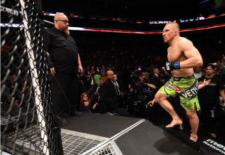 BOSTON, MA - JANUARY 18: Dennis Siver of Germany enters the Octagon before a featherweight fight against Conor McGregor of Ireland during the UFC Fight Night event at the TD Garden on January 18, 2015 in Boston, Massachusetts. (Photo by Jeff Bottari/Zuff