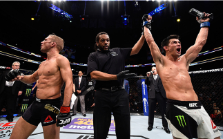 BOSTON, MA - JANUARY 17:  Dominick Cruz (R) celebrates his split-decision victory over TJ Dillashaw (L) in their UFC bantamweight championship bout during the UFC Fight Night event inside TD Garden on January 17, 2016 in Boston, Massachusetts. (Photo by J