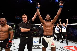 BRISBANE, AUSTRALIA - MARCH 20: (R-L) Neil Magny of the United States celebrates after defeating Hector Lombard of Cuba by TKO in their welterweight bout during the UFC Fight Night event at the Brisbane Entertainment Centre on March 20, 2016 in Brisbane,
