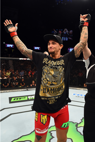 FAIRFAX, VA - APRIL 04:  Dustin Poirier celebrates after defeating Diego Ferreira by knockout in their lightweight fight during the UFC Fight Night event at the Patriot Center on April 4, 2015 in Fairfax, Virginia. (Photo by Josh Hedges/Zuffa LLC/Zuffa LL