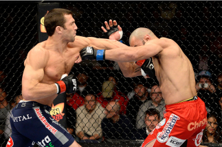 DULUTH, GA - JANUARY 15: (L-R) Luke Rockhold punches Costas Philippou in their middleweight fight during the UFC Fight Night event inside The Arena at Gwinnett Center on January 15, 2014 in Duluth, Georgia. (Photo by Jeff Bottari/Zuffa LLC/Zuffa LLC via G