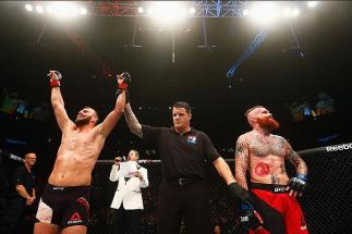 HAMBURG, GERMANY - SEPTEMBER 03:  Jessin Ayari (L) of Germany celebrates his victory overJim Wallhead (R) of England and  in their Welterweight Bout during the UFC Fight Night held at Barclaycard Arena on September 3, 2016 in Hamburg, Germany.  (Photo by 