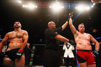 HAMBURG, GERMANY - SEPTEMBER 03: Josh Barnett (R) of USA celebrates his victory over Andrei Arlovski (L) of Belarus in their Heavyweight Bout during the UFC Fight Night held at Barclaycard Arena at Barclaycard Arena on September 3, 2016 in Hamburg, Ger