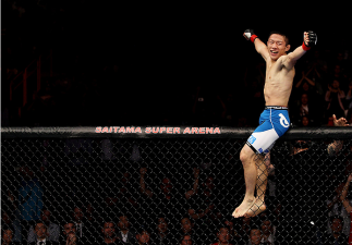 SAITAMA, JAPAN - SEPTEMBER 20: Kyoji Horiguchi celebrates his win over Jon Delos Reyes in their flyweight bout during the UFC Fight Night event inside the Saitama Arena on September 20, 2014 in Saitama, Japan. (Photo by Mitch Viquez/Zuffa LLC/Zuffa LLC v