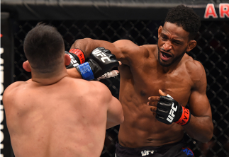 MONTERREY, MEXICO - NOVEMBER 21: (R-L) Neil Magny of the United States punches Kelvin Gastelum of the United States in their welterweight bout during the UFC Fight Night event at Arena Monterrey on November 21, 2015 in Monterrey, Mexico. (Photo by Jeff