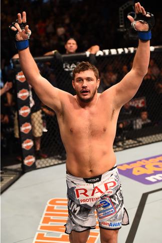 PHOENIX, AZ - DECEMBER 13: Matt Mitrione celebrates after defeating Gabriel Gonzaga of Brazil in their heavyweight fight during the UFC Fight Night event at the U.S. Airways Center on December 13, 2014 in Phoenix, Arizona. (Photo by Josh Hedges/Zuffa LL