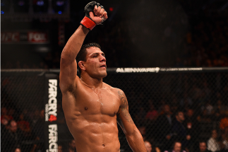 PHOENIX, AZ - DECEMBER 13: Rafael dos Anjos of Brazil celebrates after defeating Nate Diaz in their lightweight fight during the UFC Fight Night event at the U.S. Airways Center on December 13, 2014 in Phoenix, Arizona. (Photo by Josh Hedges/Zuffa LLC/Z