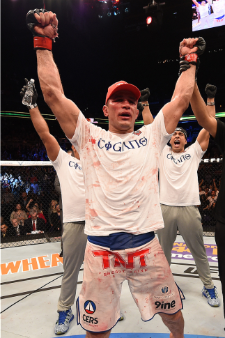 PHOENIX, AZ - DECEMBER 13: Junior dos Santos of Brazil celebrates after defeating Stipe Miocic by unanimous decision after their heavyweight fight during the UFC Fight Night event at the U.S. Airways Center on December 13, 2014 in Phoenix, Arizona. (Pho