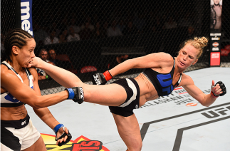 SAN DIEGO, CA - JULY 15: (R-L) Holly Holm kicks Marion Reneau in their women's bantamweight bout during the UFC event at the Valley View Casino Center on July 15, 2015 in San Diego, California. (Photo by Jeff Bottari/Zuffa LLC/Zuffa LLC via Getty Images