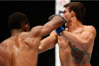 AUCKLAND, NEW ZEALAND - JUNE 28: (L-R) Neil Magny punches Rodrigo de Lima in their welterweight fight during the UFC Fight Night event at Vector Arena on June 28, 2014 in Auckland, New Zealand. (Photo by Josh Hedges/Zuffa LLC/Zuffa LLC via Getty Images)