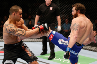 AUCKLAND, NEW ZEALAND - JUNE 28: (R-L) Nate Marquardt kicks James Te Huna in their middleweight fight during the UFC Fight Night event at Vector Arena on June 28, 2014 in Auckland, New Zealand. (Photo by Josh Hedges/Zuffa LLC/Zuffa LLC via Getty Images)