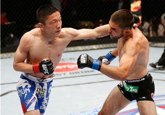 CINCINNATI, OH - MAY 10: (L-R) Kyoji Horiguchi punches Darrell Montague in their flyweight fight during the UFC Fight Night event at the U.S. Bank Arena on May 10, 2014 in Cincinnati, Ohio. (Photo by Josh Hedges/Zuffa LLC/Zuffa LLC via Getty Images)