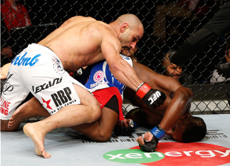 CINCINNATI, OH - MAY 10: (L-R) Costas Philippou punches Lorenz Larkin in their middleweight fight during the UFC Fight Night event at the U.S. Bank Arena on May 10, 2014 in Cincinnati, Ohio. (Photo by Josh Hedges/Zuffa LLC/Zuffa LLC via Getty Images)