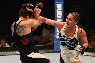 LAS VEGAS, NV - MAY 29: (R-L) Jessica Eye punches Sara McMann in their women's bantamweight bout during the UFC Fight Night event inside the Mandalay Bay Events Center on May 29, 2016 in Las Vegas, Nevada. (Photo by Josh Hedges/Zuffa LLC/Zuffa LLC via G