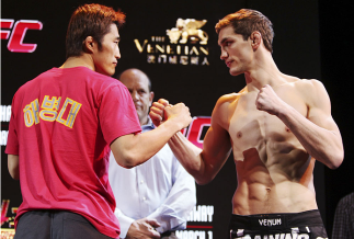 MACAU - FEBRUARY 28: (L and R) Dong Hyun Kim and John Hathaway face off during the UFC weigh-in event at the Venetian Macau on February 28, 2014 in Macau. (Photo by Mitch Viquez/Zuffa LLC/Zuffa LLC via Getty Images)