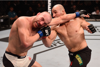 SAO PAULO, BRAZIL - NOVEMBER 07:  Glover Teixeira of Brazil punches Patrick Cummins of the United States in their light heavyweight bout during the UFC Fight Night Belfort v Henderson at Ibirapuera Gymnasium on November 7, 2015 in Sao Paulo, Brazil.  (Pho