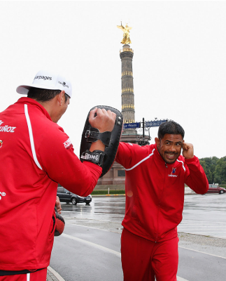 BERLIN, GERMANY - MAY 28: Mark Munoz (R) holds a Guerillia open air training session for fans and media at Victoria Statue on May 28, 2014 in Berlin, Germany. (Photo by Boris Streubel/Zuffa LLC/Zuffa LLC via Getty Images)
