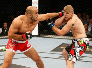 DUBLIN, IRELAND - JULY 19: (L-R) Ilir Latifi lands a left to the head of Chris Dempsey in their light heavyweight bout during the UFC Fight Night event at The O2 Dublin on July 19, 2014 in Dublin, Ireland. (Photo by Josh Hedges/Zuffa LLC/Zuffa LLC via G