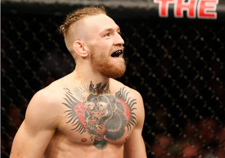 DUBLIN, IRELAND - JULY 19: Conor McGregor celebrates after his TKO victory over Diego Brandao in their featherweight bout during the UFC Fight Night event at The O2 Dublin on July 19, 2014 in Dublin, Ireland. (Photo by Josh Hedges/Zuffa LLC/Zuffa LLC vi