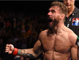 GLASGOW, SCOTLAND - JULY 18: Robert Whiteford of Scotland reacts after his TKO victory over Paul Redmond of Ireland in their featherweight fight during the UFC Fight Night event inside the SSE Hydro on July 18, 2015 in Glasgow, Scotland. (Photo by Josh