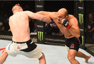 GLASGOW, SCOTLAND - JULY 18: (R-L) Ilir Latifi of Sweden punches Hans Stringer of the Netherlands in their light heavyweight fight during the UFC Fight Night event inside the SSE Hydro on July 18, 2015 in Glasgow, Scotland. (Photo by Josh Hedges/Zuffa L