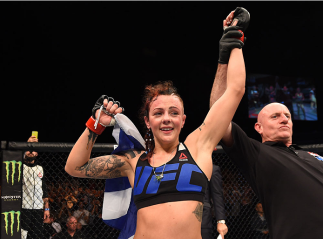 GLASGOW, SCOTLAND - JULY 18: Joanne Calderwood of Scotland reacts after defeating Cortney Casey of the United States in their women's strawweight fight during the UFC Fight Night event inside the SSE Hydro on July 18, 2015 in Glasgow, Scotland. (Photo