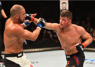 GLASGOW, SCOTLAND - JULY 18: (R-L) Michael Bisping of England punches Thales Leites in their middleweight fight during the UFC Fight Night event inside the SSE Hydro on July 18, 2015 in Glasgow, Scotland. (Photo by Josh Hedges/Zuffa LLC/Zuffa LLC via Ge