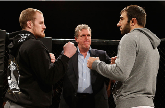 LONDON, ENGLAND - MARCH 05:  (L-R) Opponents Gunnar Nelson and Omari Akhmedov face off after an open training session for fans and media at One Embankment on March 5, 2014 in London, England. (Photo by Josh Hedges/Zuffa LLC/Zuffa LLC via Getty Images)