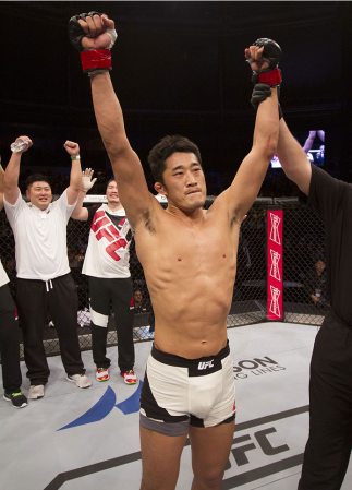 SEOUL, SOUTH KOREA - NOVEMBER 28: Dong Hyun Kim of South Korea has his hand raised after his win over Dominic Waters of the United States of America in their welterweight bout during the UFC Fight Night at the Olympic Park Gymnastics Arena on November 28