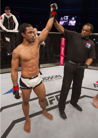 SEOUL, SOUTH KOREA - NOVEMBER 28: Benson Henderson of the United States of America has his hand raised after a split decision victory over Jorge Masvidal of the United States of America in their welterweight bout during the UFC Fight Night at the Olympic