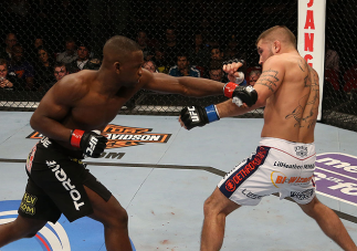 SEATTLE, WA - DECEMBER 08: (L-R) Yves Edwards punches Jeremy Stephens during their lightweight bout at the UFC on FOX event on December 8, 2012 at Key Arena in Seattle, Washington. (Photo by Ezra Shaw/Zuffa LLC/Zuffa LLC via Getty Images) *** Local Cap