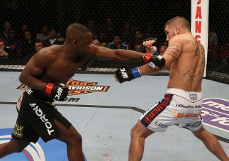 SEATTLE, WA - DECEMBER 08:  (L-R) Yves Edwards punches Jeremy Stephens during their lightweight bout at the UFC on FOX event on December 8, 2012  at Key Arena in Seattle, Washington.  (Photo by Ezra Shaw/Zuffa LLC/Zuffa LLC via Getty Images) *** Local Cap