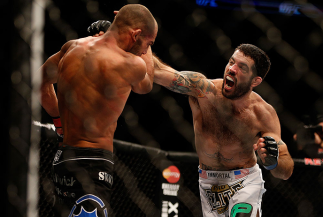 SEATTLE, WA - DECEMBER 08: (R-L) Matt Brown punches Mike Swick during their welterweight bout at the UFC on FOX event on December 8, 2012 at Key Arena in Seattle, Washington. (Photo by Ezra Shaw/Zuffa LLC/Zuffa LLC via Getty Images) *** Local Caption *