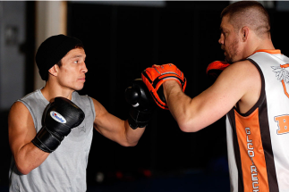 SACRAMENTO, CA - DECEMBER 11: (L-R) Joseph Benavidez works out with head coach Duane Ludwig during an open training session for media at Ultimate Fitness on December 11, 2013 in Sacramento, California. (Photo by Josh Hedges/Zuffa LLC/Zuffa LLC via Getty