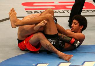 SAN JOSE, CA - JULY 11: Alex Caceres (right) attempts to submit Damacio Page during their bantamweight bout at HP Pavilion on July 11, 2012 in San Jose, California. (Photo by Ezra Shaw/Zuffa LLC/Zuffa LLC via Getty Images) *** Local Caption *** Damaci