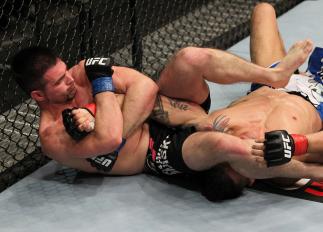STOCKHOLM, SWEDEN - APRIL 14: (L-R) John Maguire secures an arm bar submission against Damarques Johnson during their welterweight bout at the UFC on Fuel TV event at Ericsson Globe on April 14, 2012 in Stockholm, Sweden. (Photo by Josh Hedges/Zuffa LLC