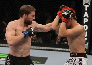 NASHVILLE, TN - JANUARY 20: (L-R) Nick Denis punches Joseph Sandoval during the UFC on FX event at Bridgestone Arena on January 20, 2012 in Nashville, Tennessee. (Photo by Josh Hedges/Zuffa LLC/Zuffa LLC via Getty Images)