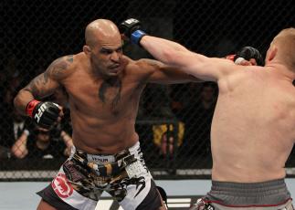NASHVILLE, TN - JANUARY 20: (L-R) Jorge Rivera punches Eric Schafer during the UFC on FX event at Bridgestone Arena on January 20, 2012 in Nashville, Tennessee. (Photo by Josh Hedges/Zuffa LLC/Zuffa LLC via Getty Images)