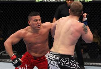 NASHVILLE, TN - JANUARY 20: (L-R) Pat Barry delivers a punch against Christian Morecraft during the UFC on FX event at Bridgestone Arena on January 20, 2012 in Nashville, Tennessee. (Photo by Josh Hedges/Zuffa LLC/Zuffa LLC via Getty Images)