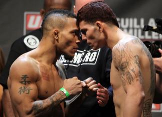 NASHVILLE, TN - JANUARY 19: (L-R) Bantamweight opponents Mike Easton and Jared Papazian face off after weighing in during the UFC on FX official weigh in at Bridgestone Arena on January 19, 2012 in Nashville, Tennessee. (Photo by Josh Hedges/Zuffa LLC/Z