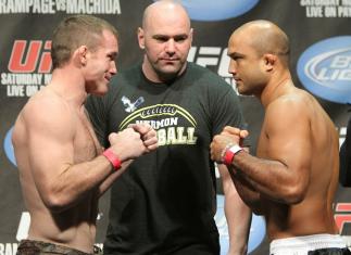 Welterweight opponents Matt Hughes (L) and BJ Penn (R) face off as UFC President Dana White looks on at the UFC 123 weigh-in at the Palace of Auburn Hills on November 19, 2010 in Auburn Hills, Michigan. (Photo by Josh Hedges/Zuffa LLC/Zuffa LLC via Getty